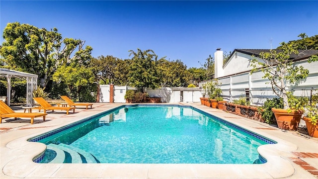 view of swimming pool with a patio area