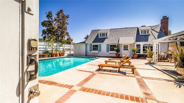 view of swimming pool with a patio