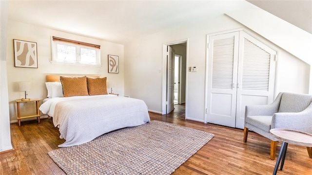 bedroom with hardwood / wood-style flooring and a closet