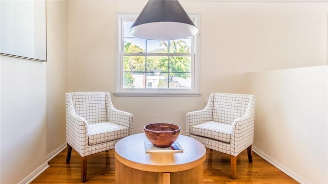 sitting room with hardwood / wood-style floors