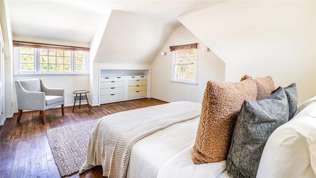 bedroom featuring dark wood-type flooring and vaulted ceiling