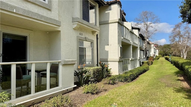 view of property exterior featuring a yard