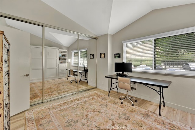 office area featuring hardwood / wood-style flooring and lofted ceiling