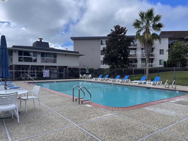 view of swimming pool with a patio area