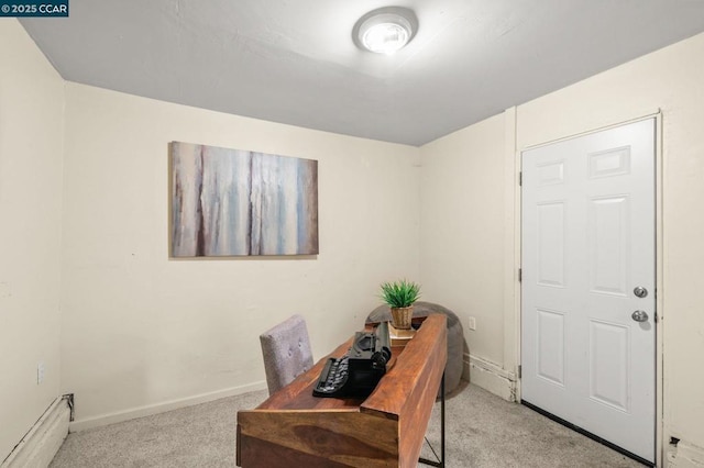 carpeted home office featuring baseboard heating