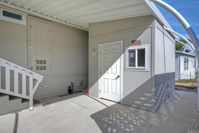 doorway to property with a patio area