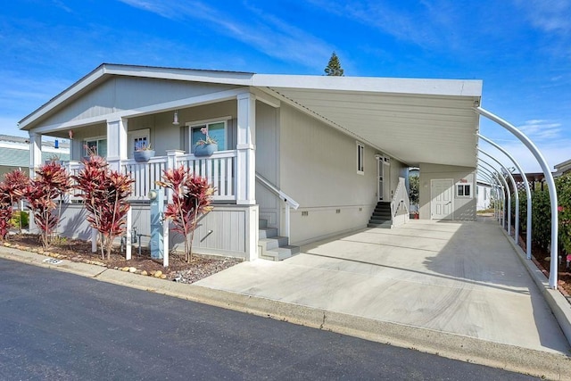 view of front of home with a carport