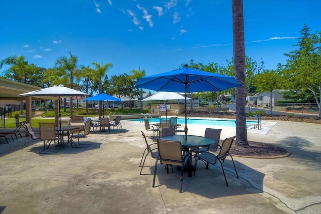 view of patio / terrace featuring a community pool