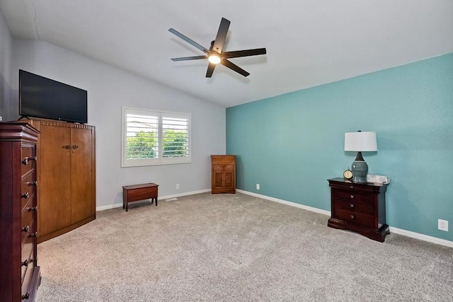 bedroom with lofted ceiling, light carpet, and ceiling fan