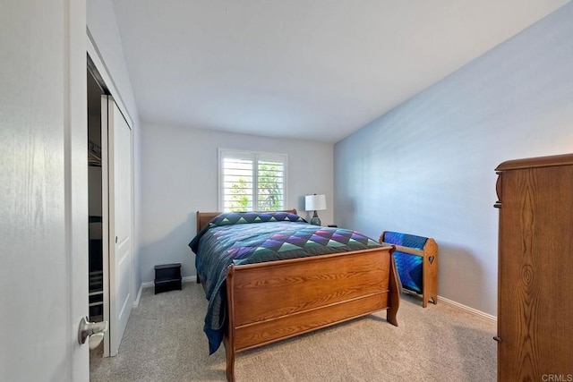 carpeted bedroom featuring a closet