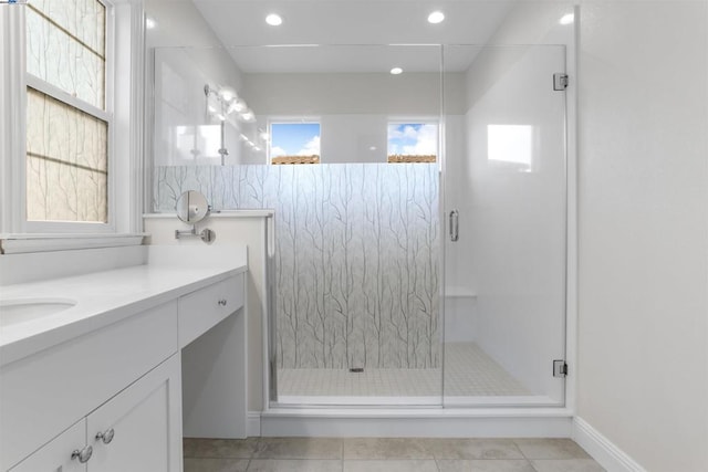 bathroom with vanity, tile patterned floors, and a shower with shower door