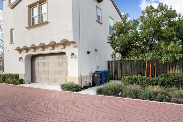 view of side of property featuring a garage