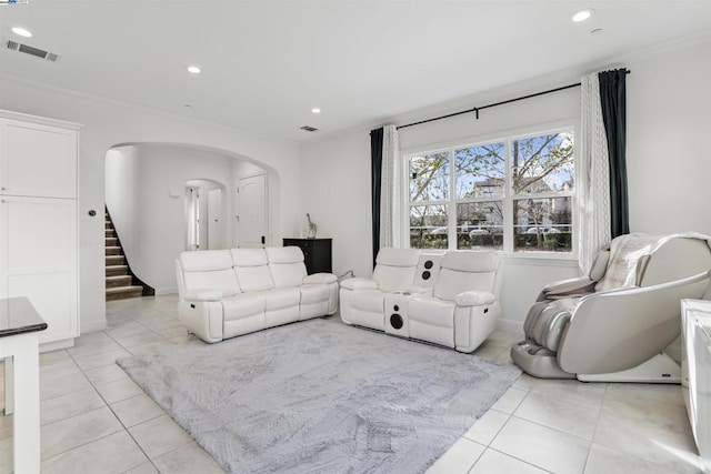 tiled living room featuring crown molding