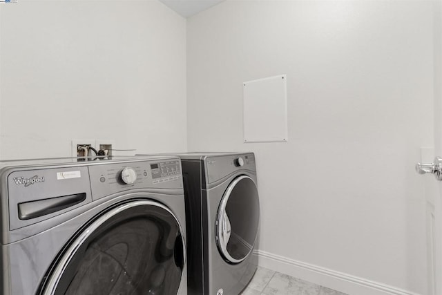 washroom featuring independent washer and dryer