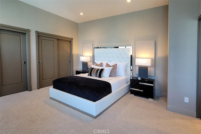 bedroom featuring light colored carpet