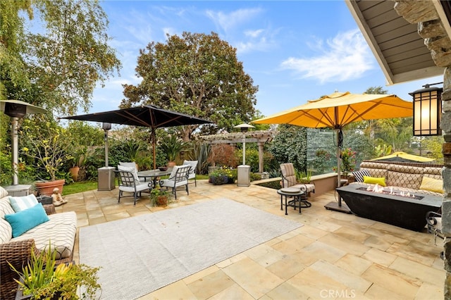 view of patio featuring an outdoor living space with a fire pit and outdoor dining area