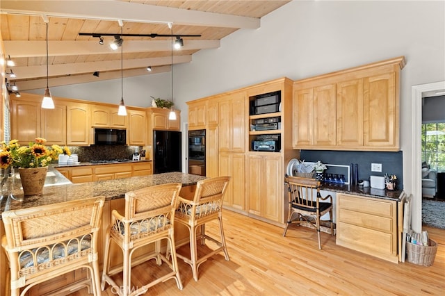 kitchen with black appliances, light brown cabinetry, vaulted ceiling with beams, wooden ceiling, and a peninsula
