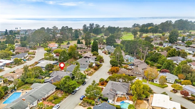 birds eye view of property with a residential view and a water view