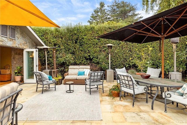 view of patio featuring outdoor lounge area and outdoor dining area