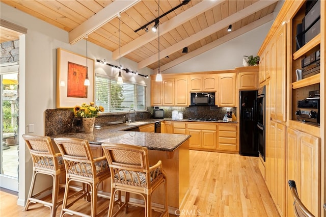 kitchen with a peninsula, wooden ceiling, vaulted ceiling with beams, light brown cabinets, and black appliances