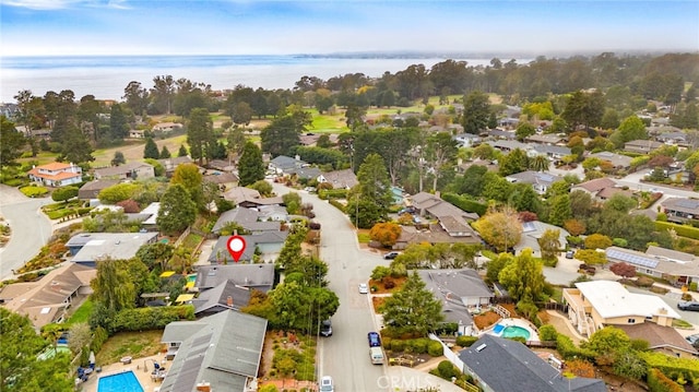 birds eye view of property featuring a water view and a residential view