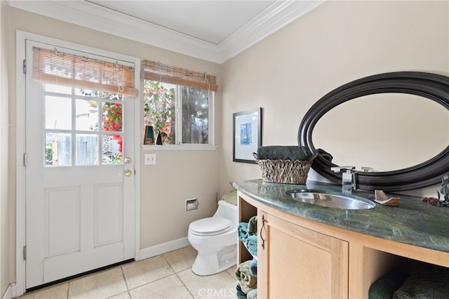 bathroom with ornamental molding, vanity, tile patterned floors, and toilet