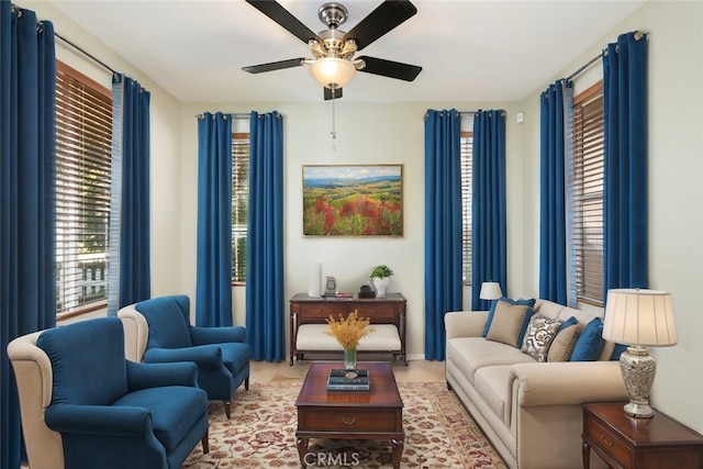 living area featuring a ceiling fan and plenty of natural light