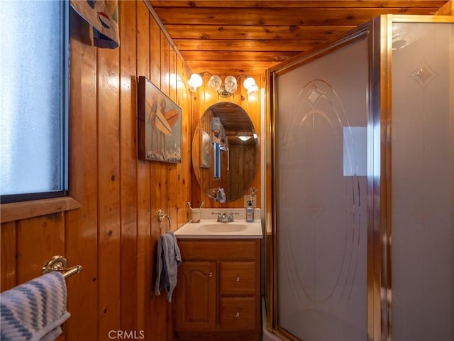 bathroom featuring vanity, walk in shower, wooden ceiling, and wood walls