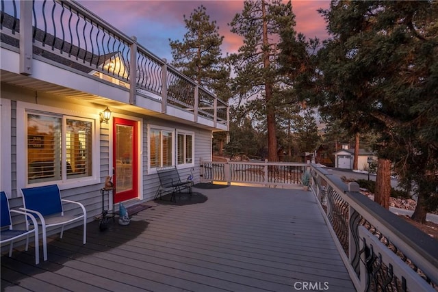 deck at dusk with a storage unit