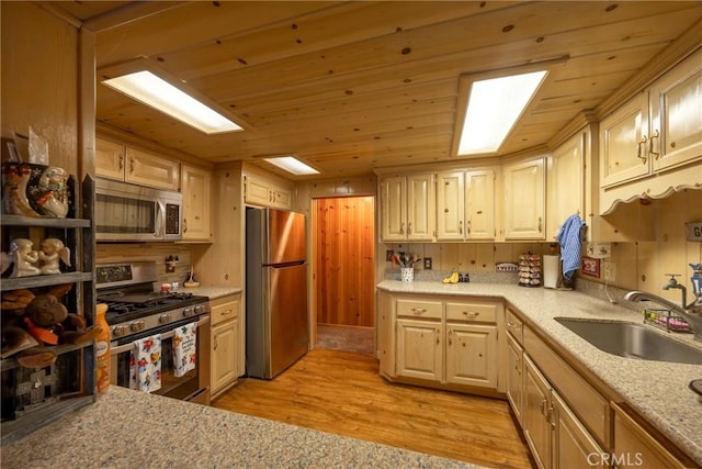 kitchen with sink, wood ceiling, light hardwood / wood-style flooring, stainless steel appliances, and light stone countertops