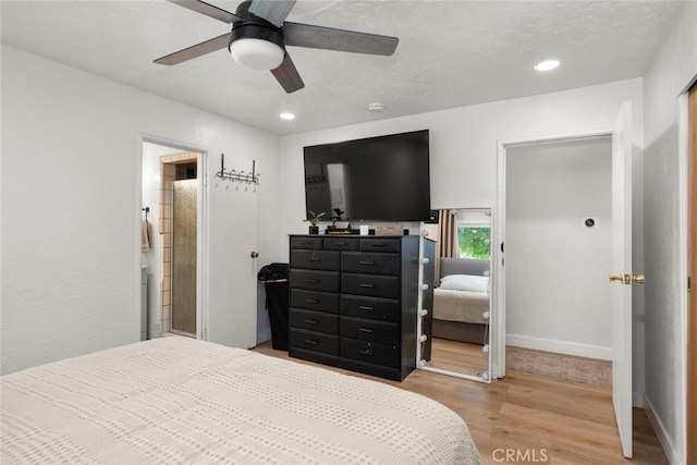 bedroom with ceiling fan and light hardwood / wood-style floors