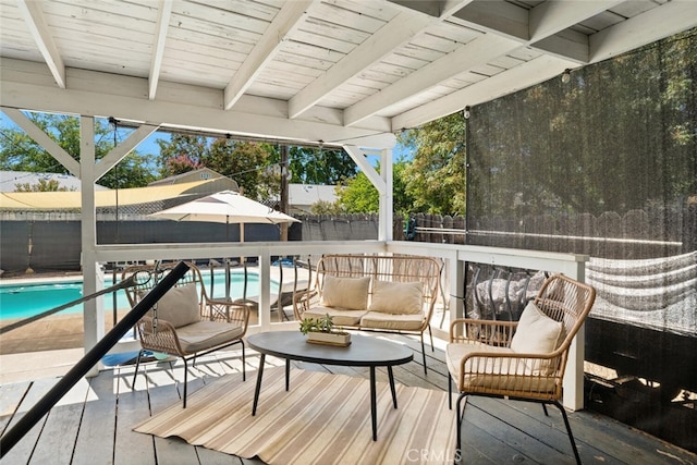 wooden deck featuring a fenced in pool and outdoor lounge area