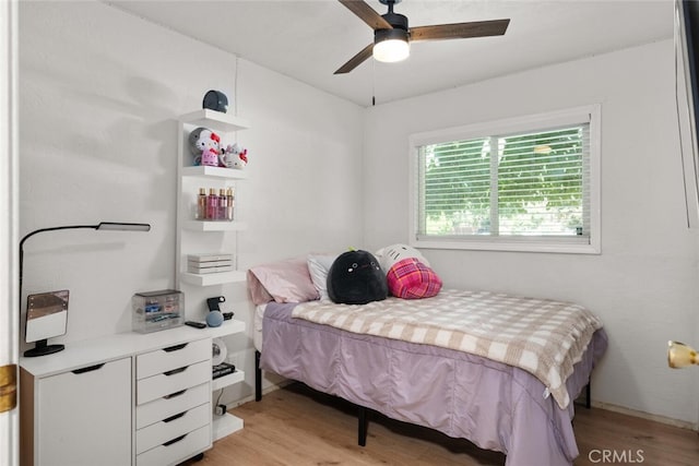 bedroom with ceiling fan and light wood-type flooring