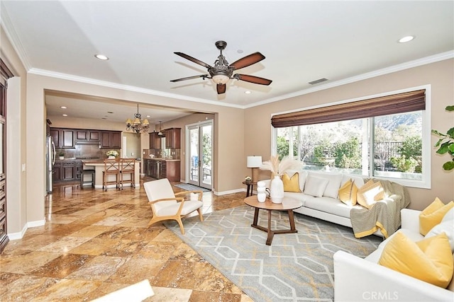 living room with crown molding and ceiling fan with notable chandelier