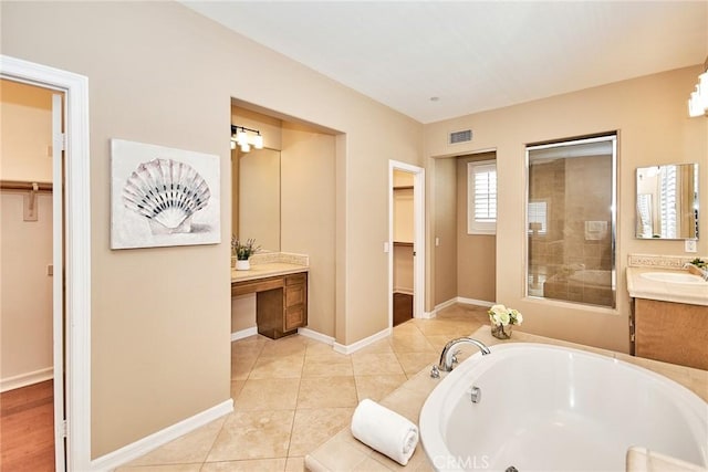 bathroom featuring vanity, separate shower and tub, and tile patterned floors