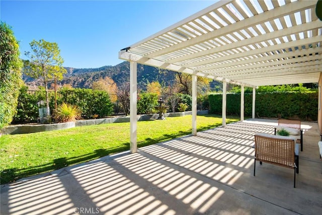 view of patio / terrace featuring a mountain view and a pergola