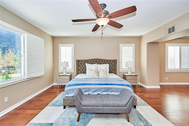 bedroom featuring hardwood / wood-style floors and ceiling fan