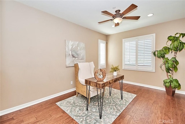 home office featuring ceiling fan and hardwood / wood-style floors