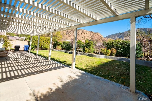 view of patio with a mountain view and a pergola