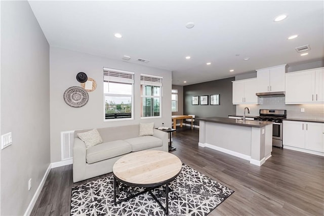 living room with dark hardwood / wood-style floors