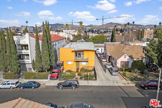 birds eye view of property with a mountain view