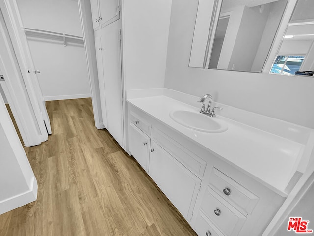 bathroom featuring vanity and hardwood / wood-style flooring