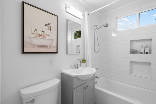 full bathroom with shower / tub combo with curtain, vanity, and toilet