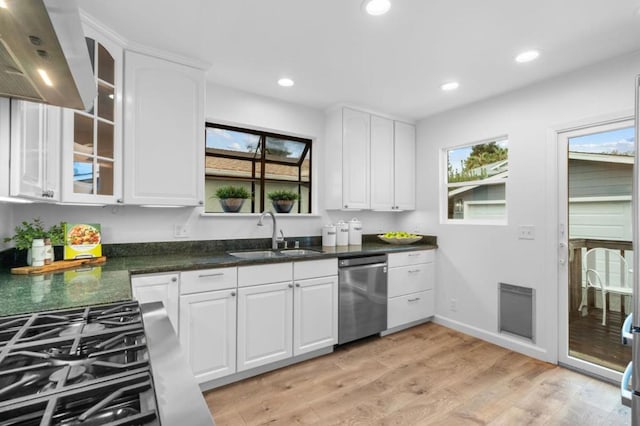 kitchen with white cabinetry, sink, dishwasher, and light wood-type flooring