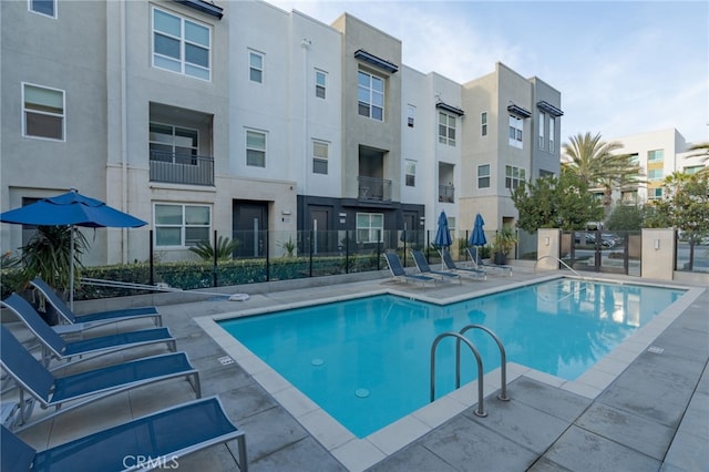 view of swimming pool with a patio