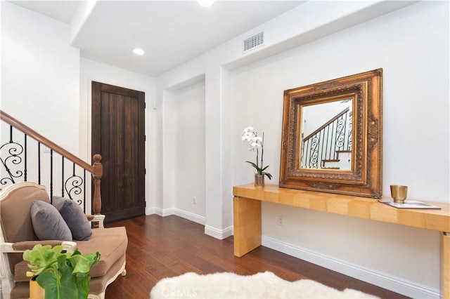 foyer with dark wood-type flooring