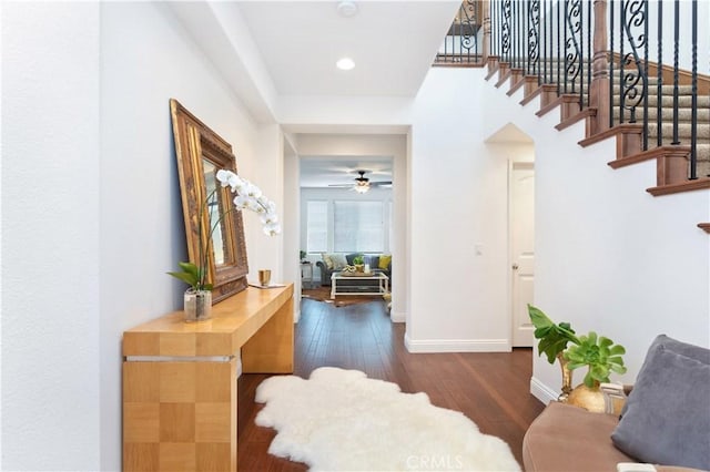 interior space with dark hardwood / wood-style floors and ceiling fan