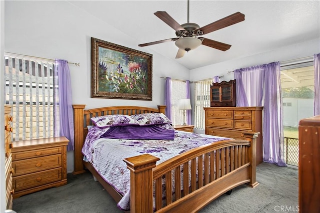 carpeted bedroom featuring vaulted ceiling, access to outside, and ceiling fan