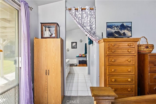 hall featuring light tile patterned floors