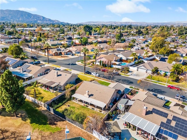 birds eye view of property with a mountain view